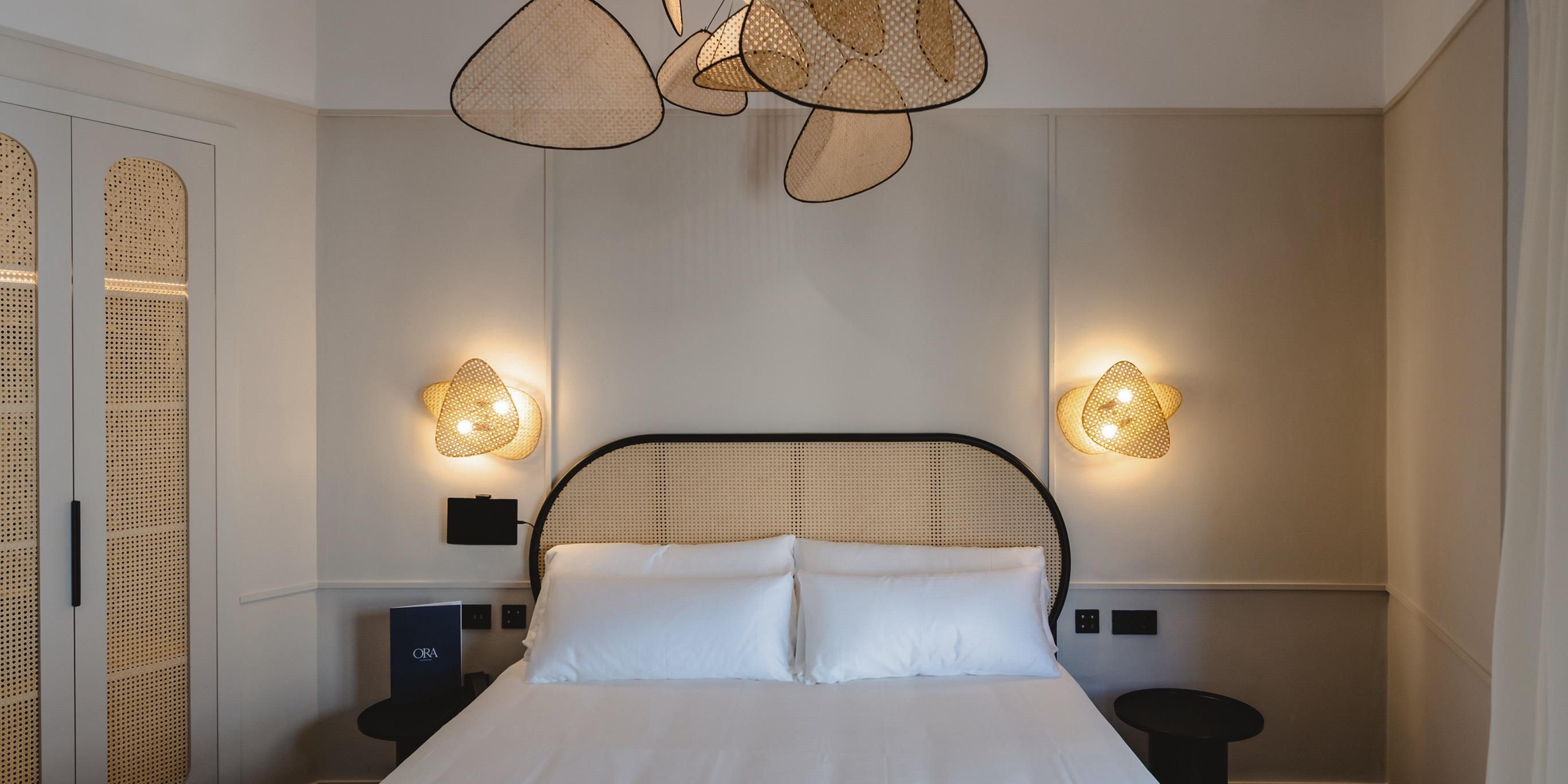 Woven wall lamp installed in a luxury resort interior with contemporary natural architecture.