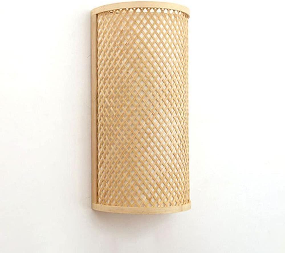 Handwoven rattan wall lamp photographed on a clean white studio background.