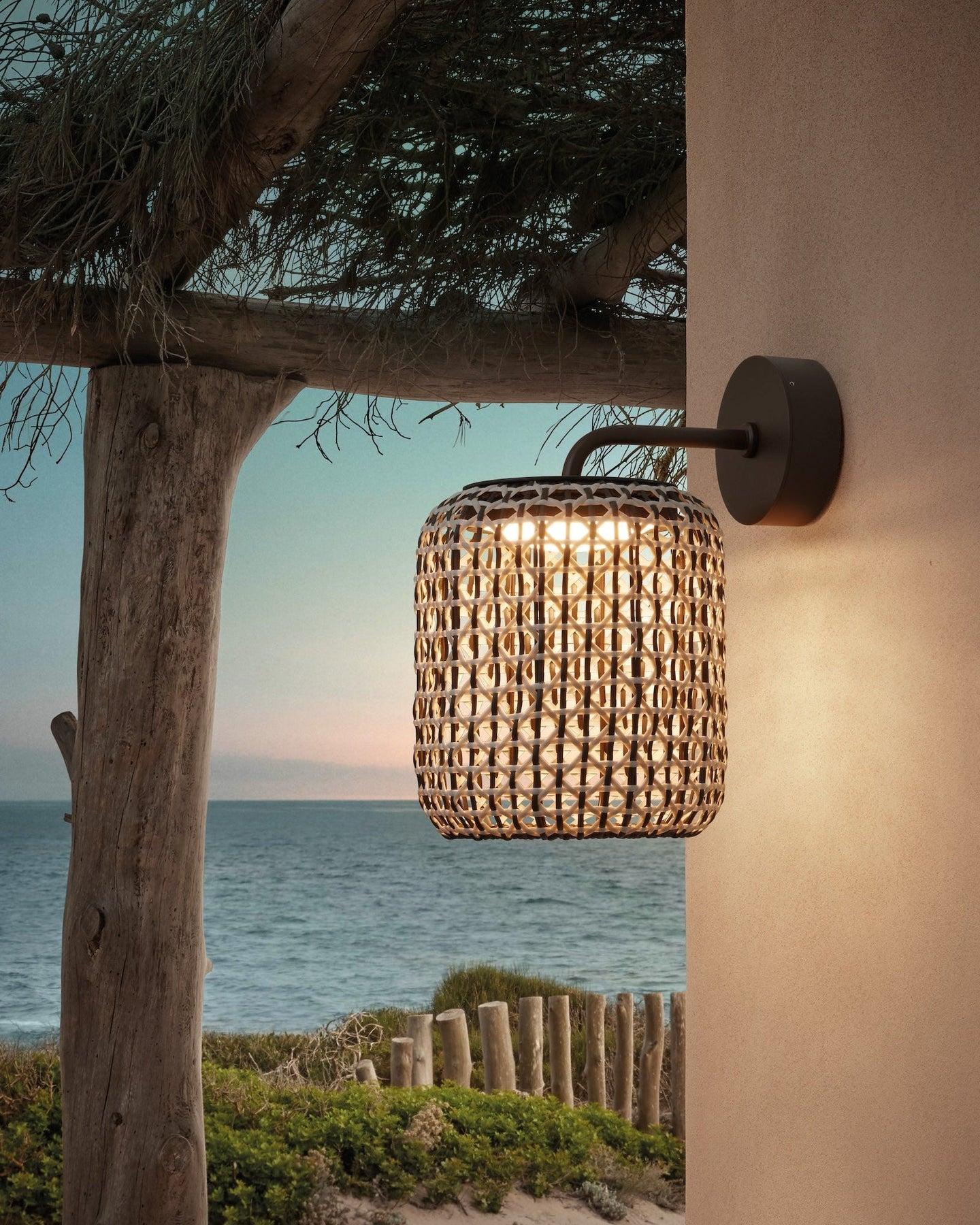 Woven wall lamp installed in a luxury resort interior with contemporary natural architecture.