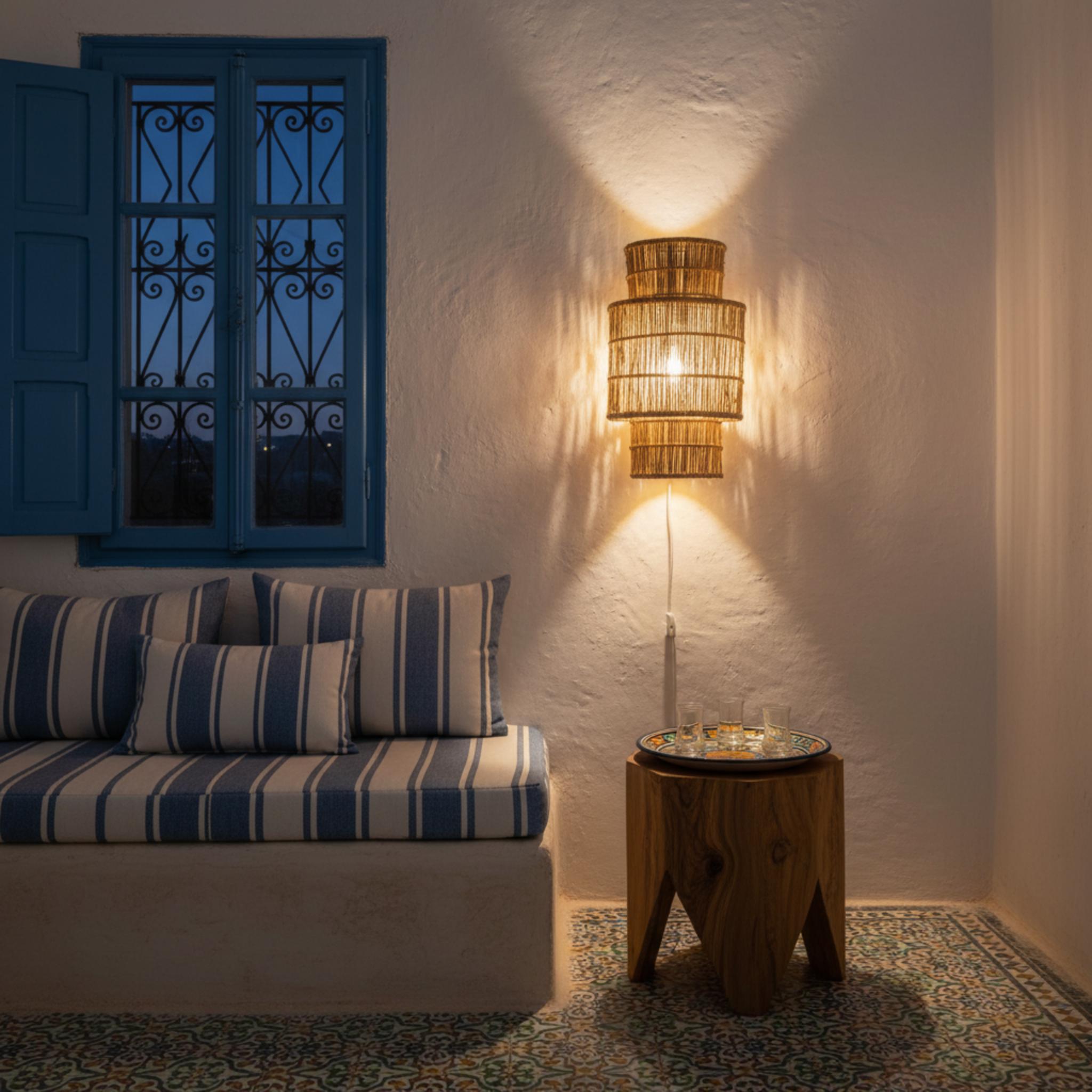 Woven wall lamp installed in a luxury resort interior with contemporary natural architecture.