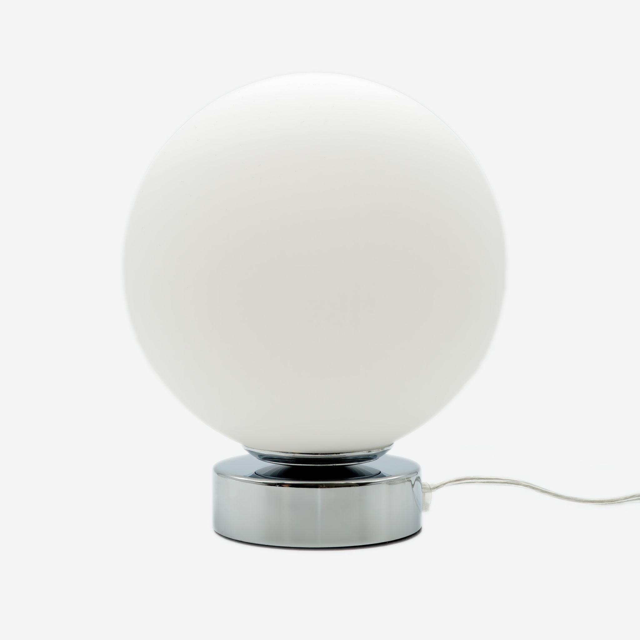 Front view of a globe table lamp highlighting the elegant spherical form and refined architectural design.