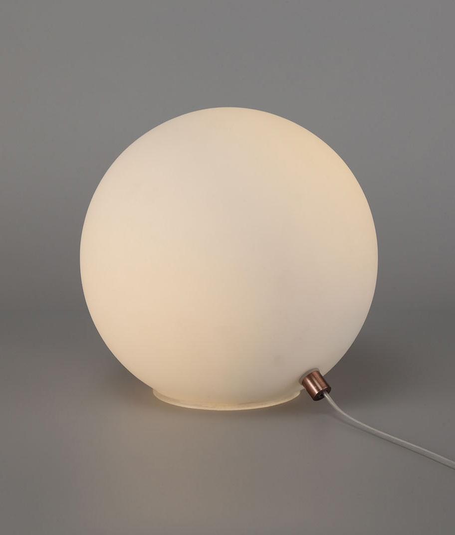 Front view of a globe table lamp highlighting the elegant spherical form and refined architectural design.