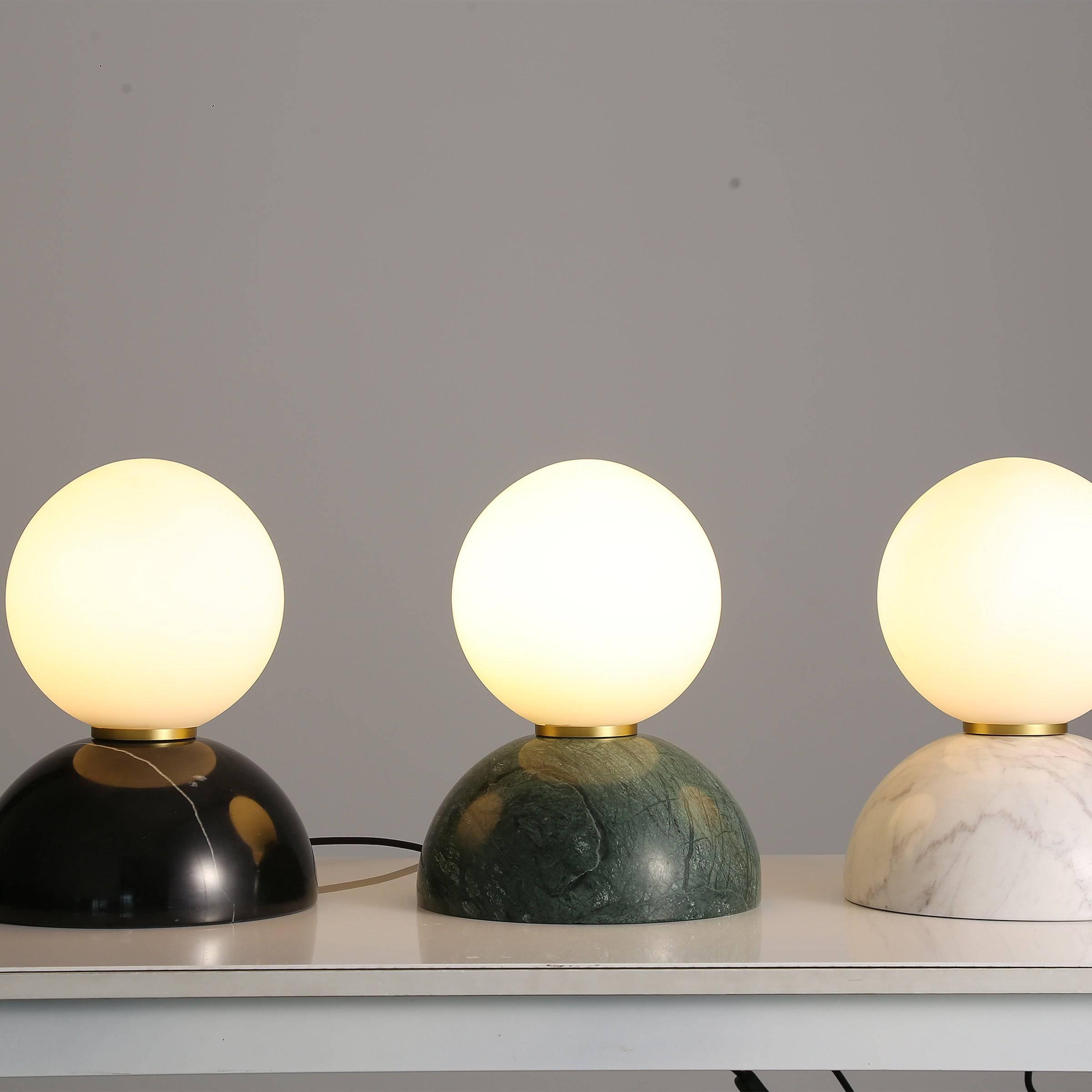 Collection of globe table lamps featuring opal glass diffusers and premium decorative finishes.