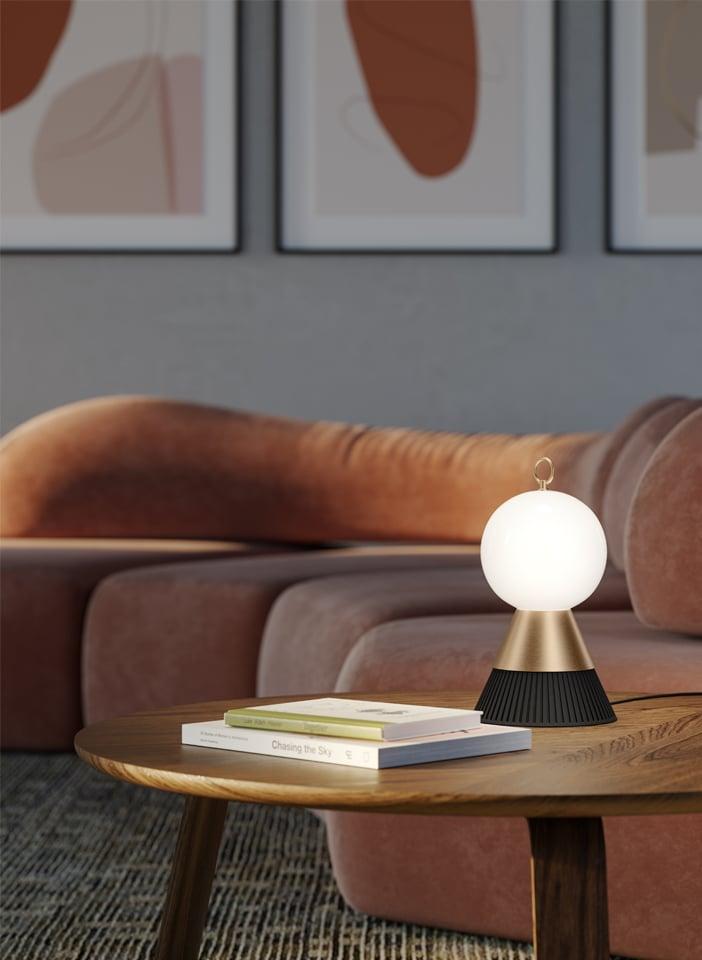 Globe table lamp placed on a luxury hotel bedside table creating soft and balanced ambient illumination.