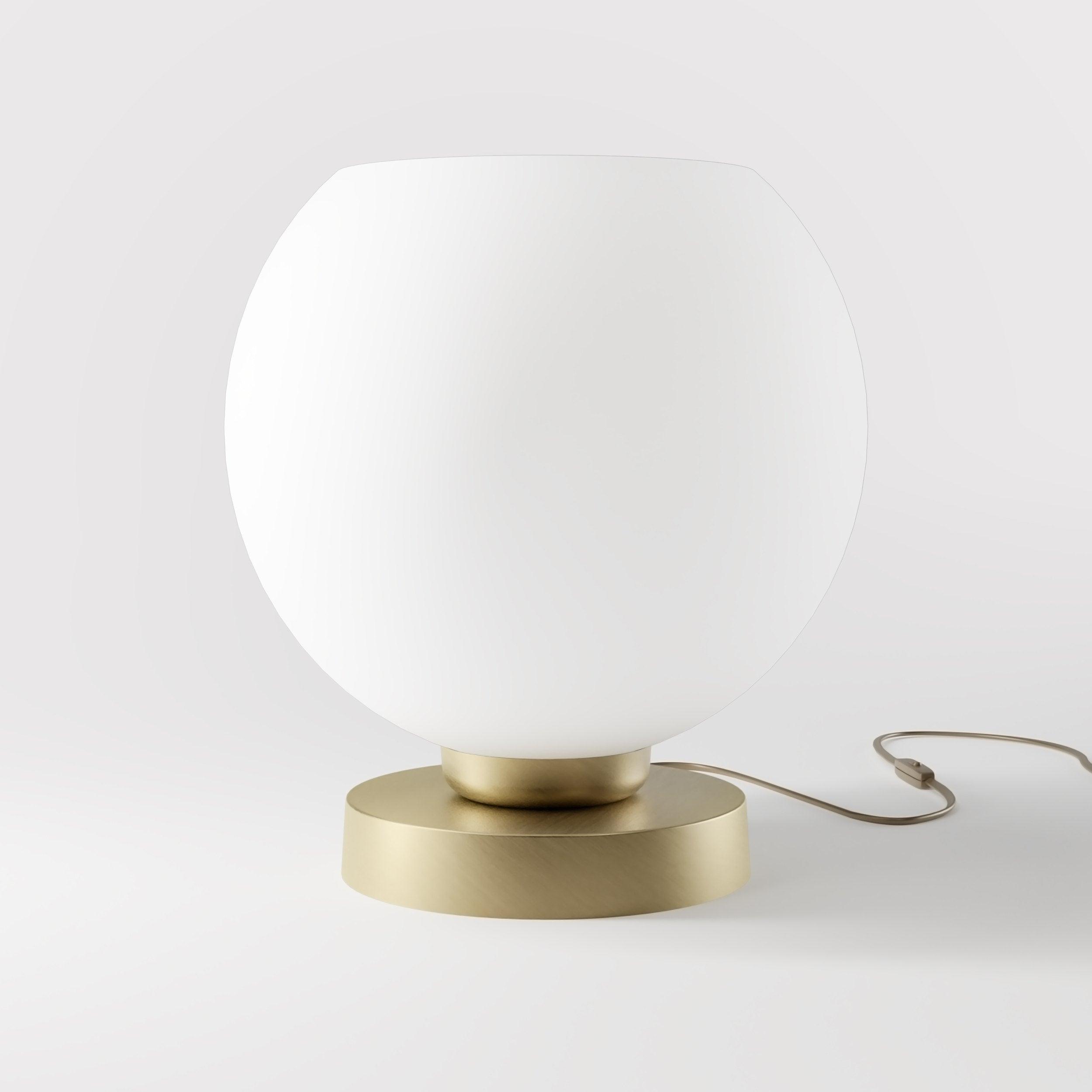 Front view of a globe table lamp highlighting the elegant spherical form and refined architectural design.