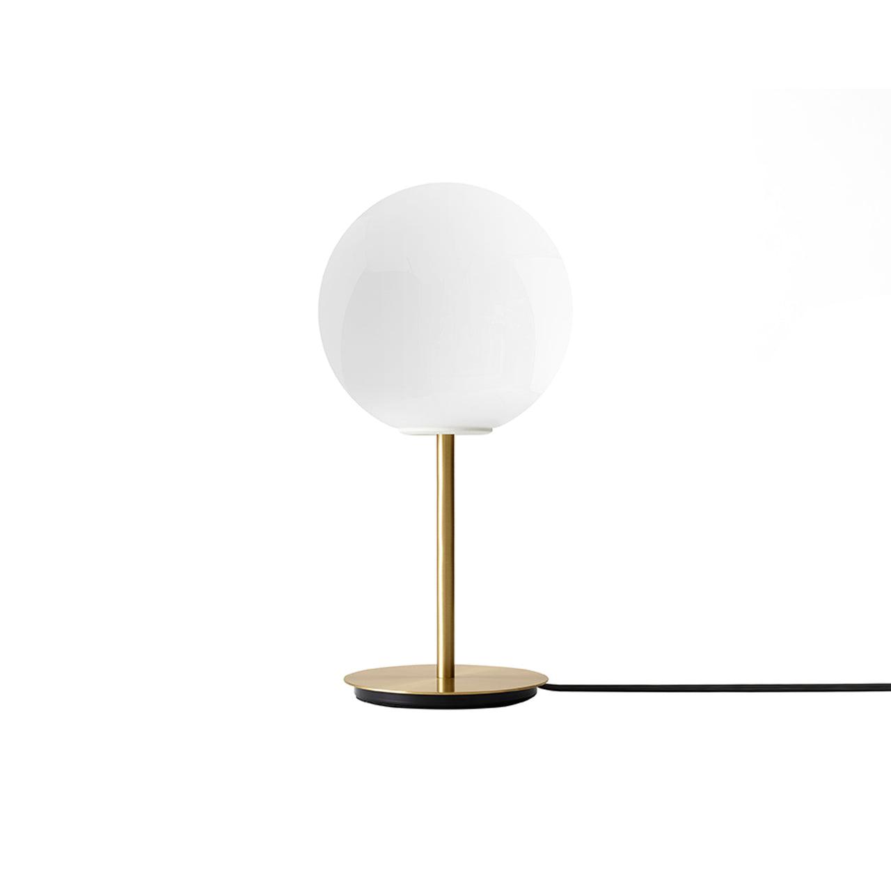 Globe table lamp photographed on a clean white background showcasing its opal spherical diffuser and premium base.