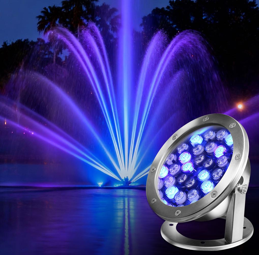 LED underwater spotlights illuminating a fountain and landscape water feature.