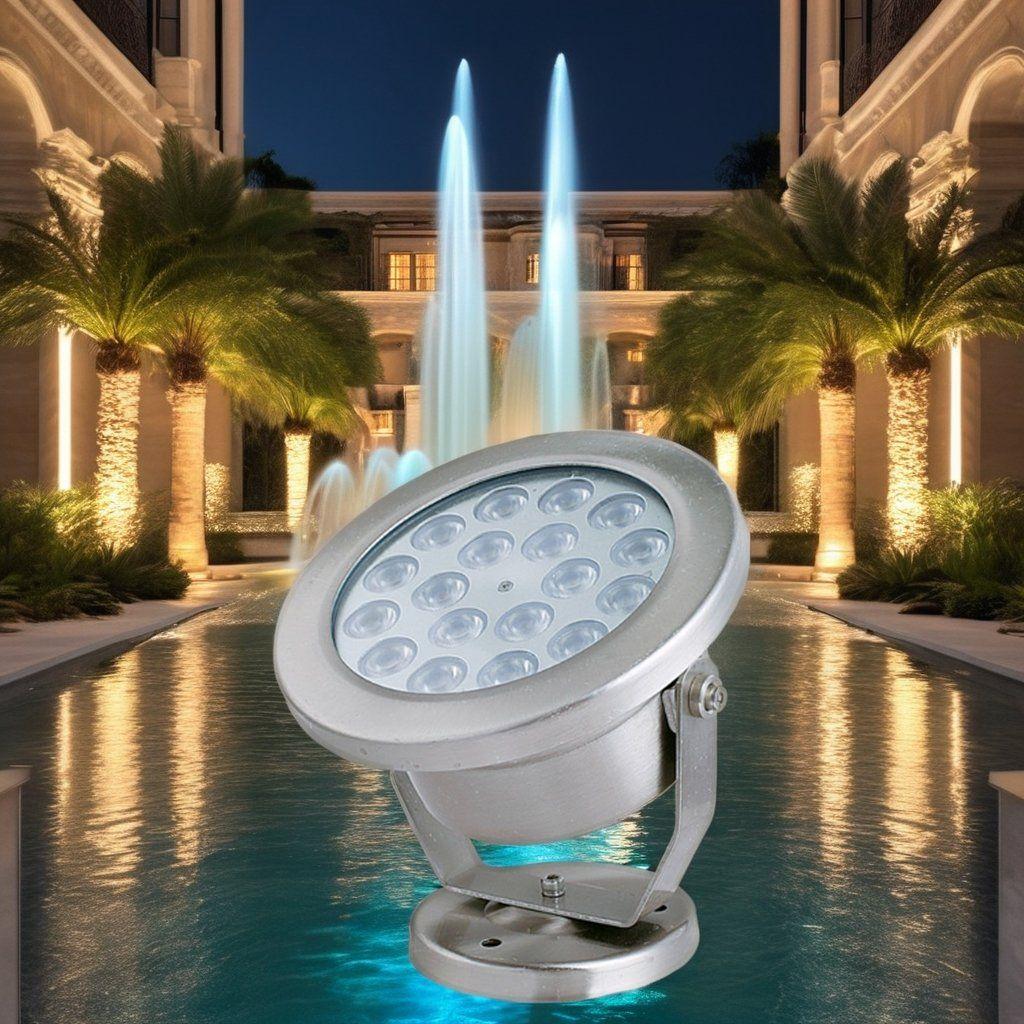 LED underwater spotlights illuminating a fountain and landscape water feature.
