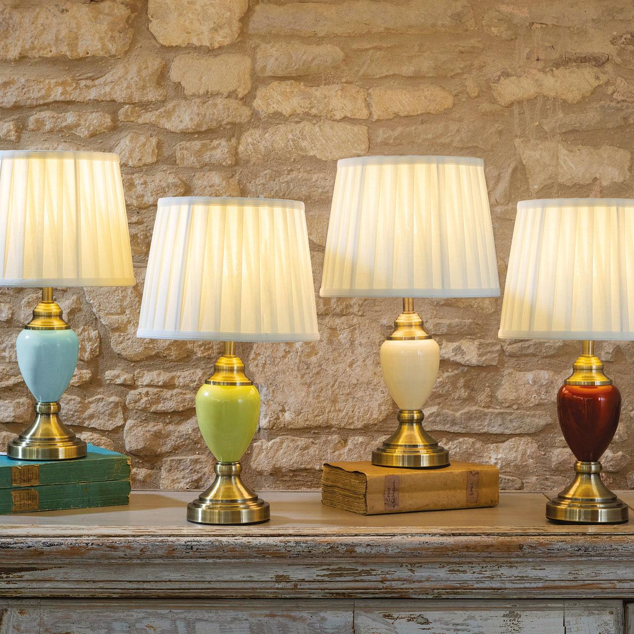 Collection of classic table lamps featuring brass, ceramic and fabric shade combinations for elegant interiors.