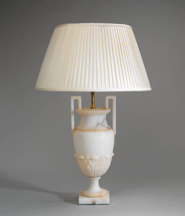 Front view of a classic table lamp highlighting refined proportions, premium materials and timeless design.
