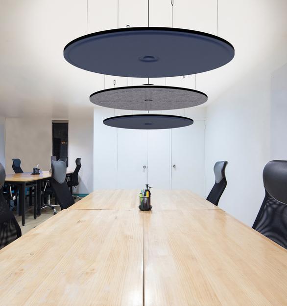Acoustic pendant lighting installed in a modern office workspace.