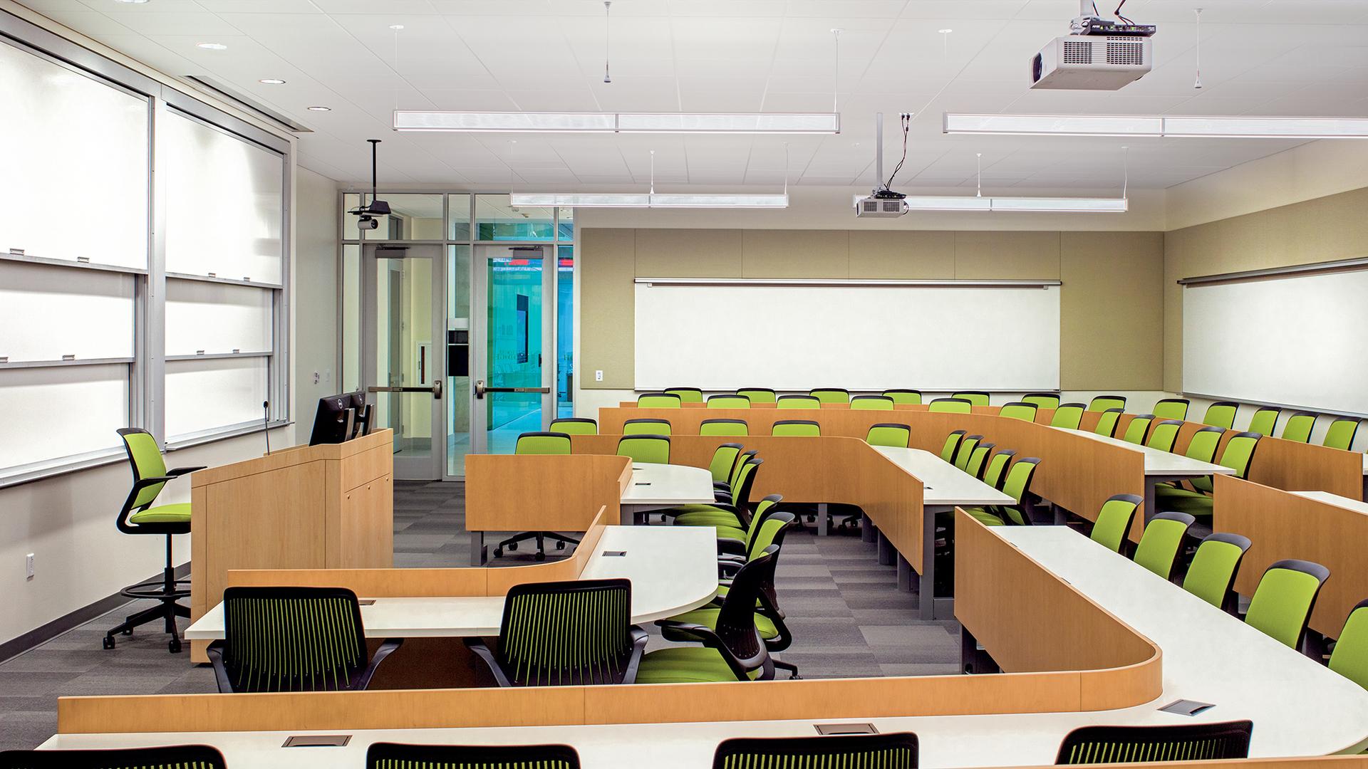 Acoustic pendant lighting installed in a modern office workspace.