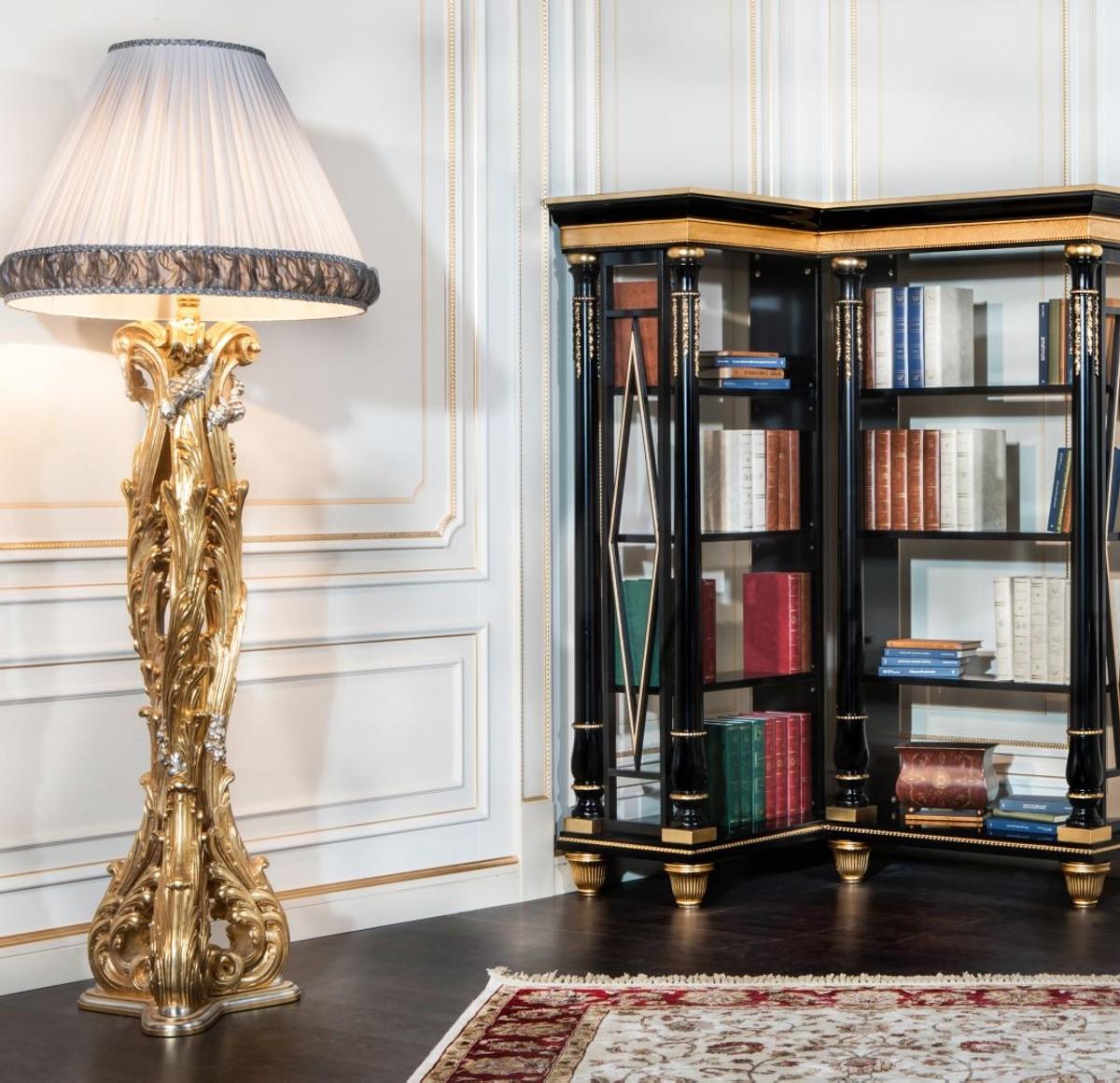 Classic floor lamp positioned beside a seating area in a luxury hotel lounge, creating warm ambient lighting and timeless sophistication.