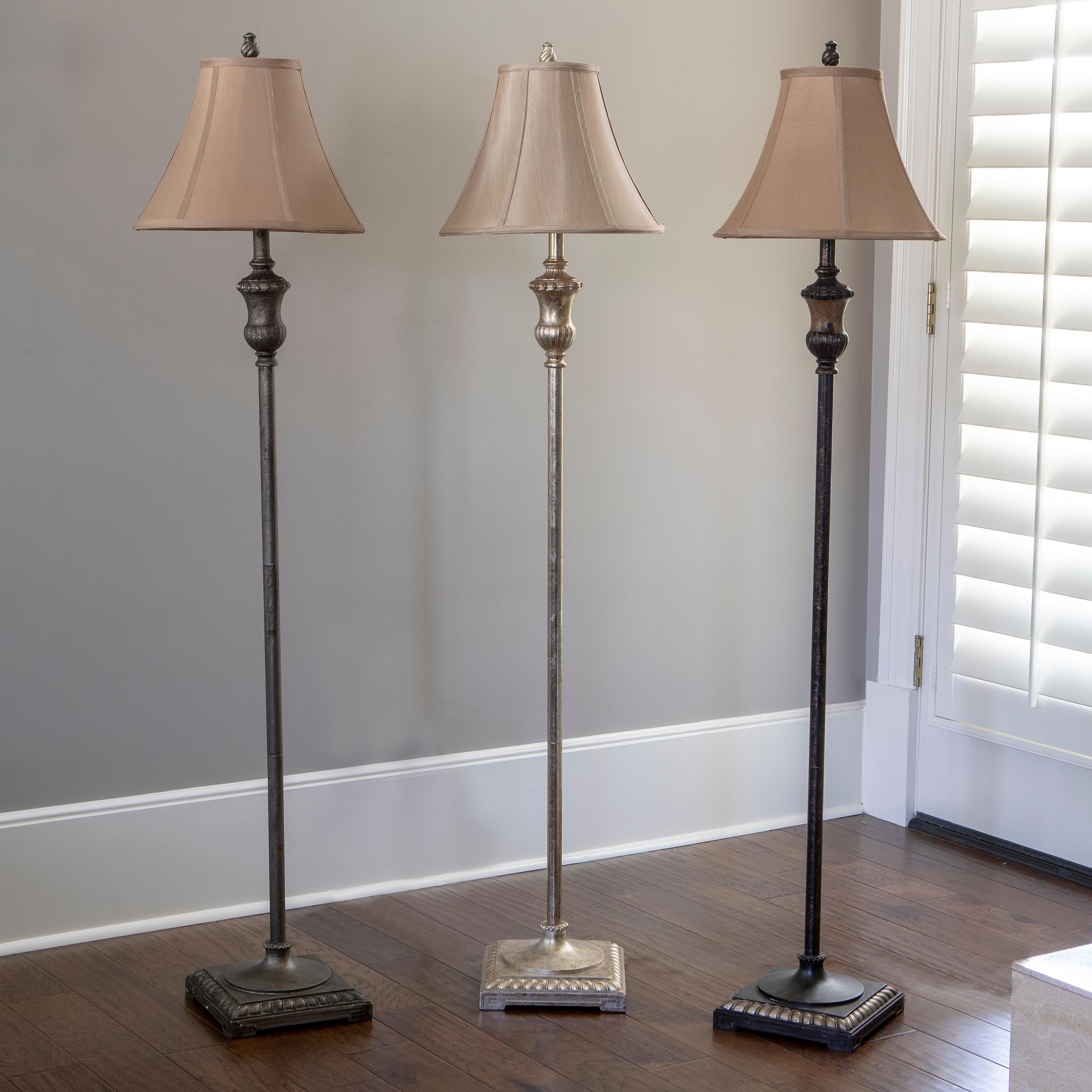 Collection of classic floor lamps featuring brass, ceramic and fabric shade combinations for elegant residential and hospitality interiors.