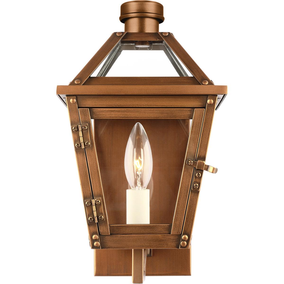 Lantern wall lamp photographed on a clean white studio background featuring a geometric metal frame.