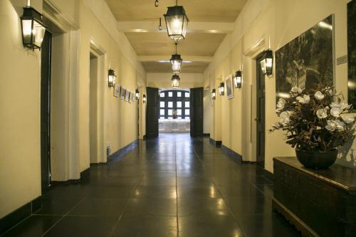 Lantern wall lamp installed beside the entrance of a luxury residence with timeless architectural styling.