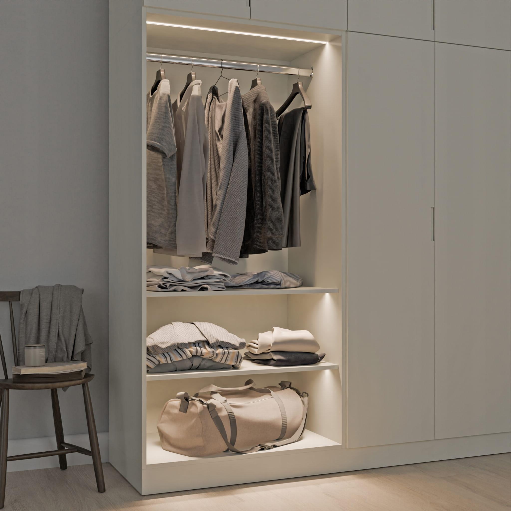 Furniture LED profiles integrated into a contemporary wardrobe and shelving system.