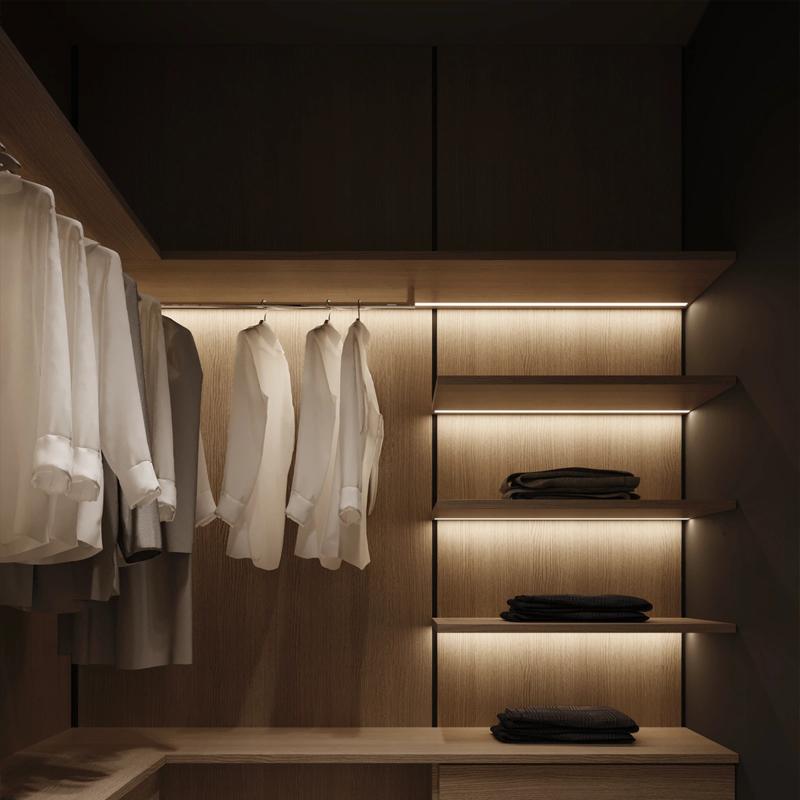 Furniture LED profiles integrated into a contemporary wardrobe and shelving system.
