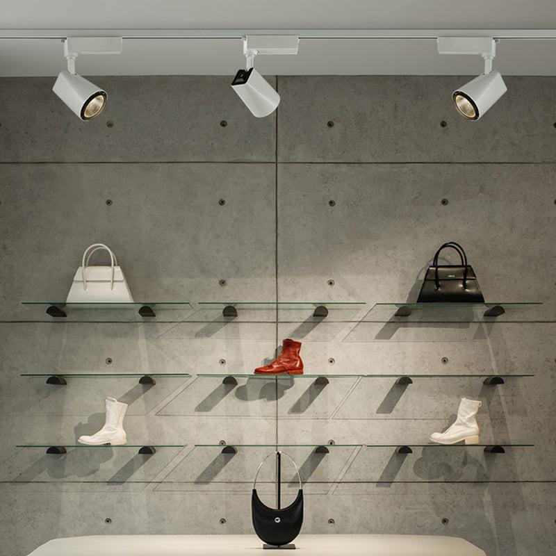 Front view of a track-mounted retail display spotlight.