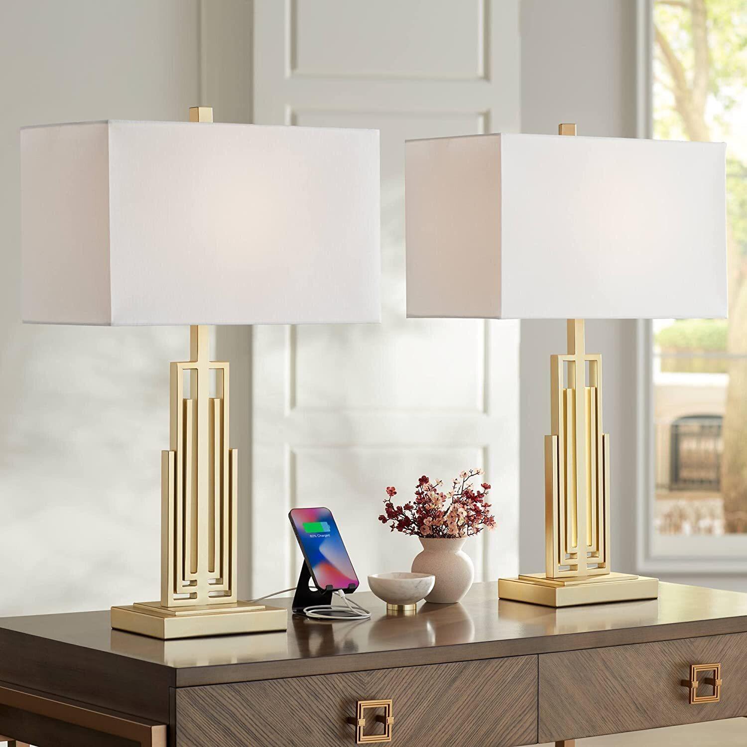 Art Deco table lamp placed in a boutique hotel lounge creating a glamorous atmosphere with warm ambient lighting.