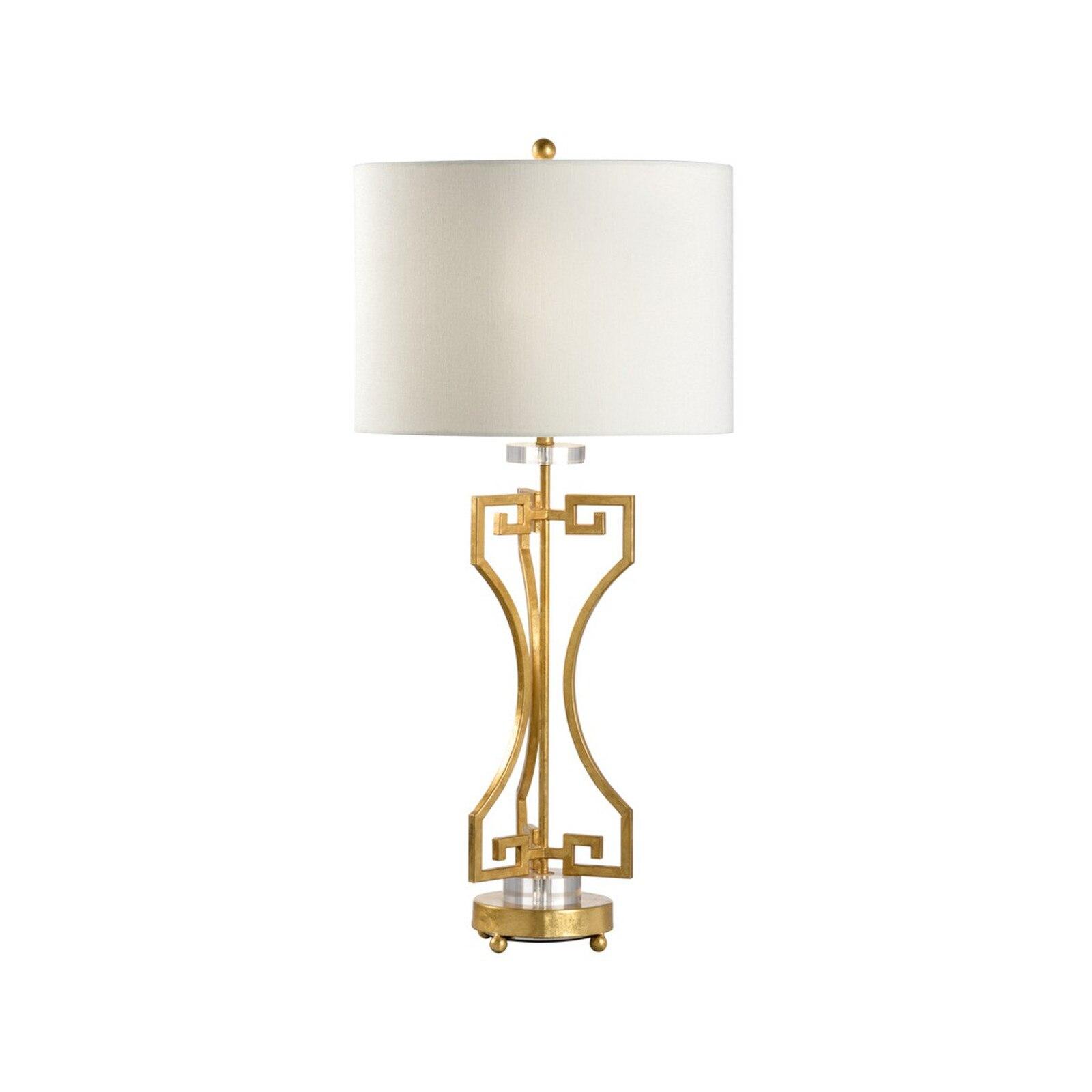 Art Deco table lamp photographed on a clean white background showcasing geometric forms, luxurious materials and elegant finishes.