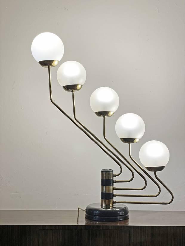Front view of an Art Deco table lamp highlighting symmetrical detailing and refined architectural proportions.