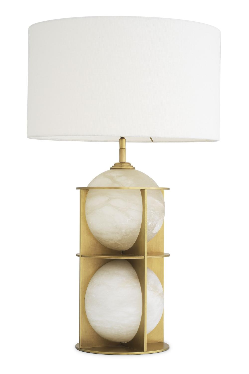 Art Deco table lamp photographed on a clean white background showcasing geometric forms, luxurious materials and elegant finishes.