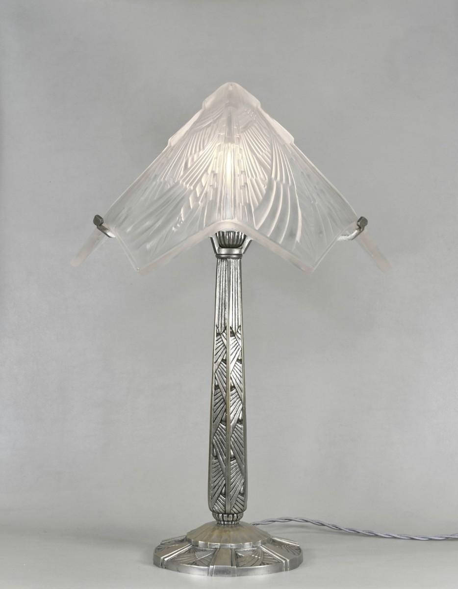 Front view of an Art Deco table lamp highlighting symmetrical detailing and refined architectural proportions.