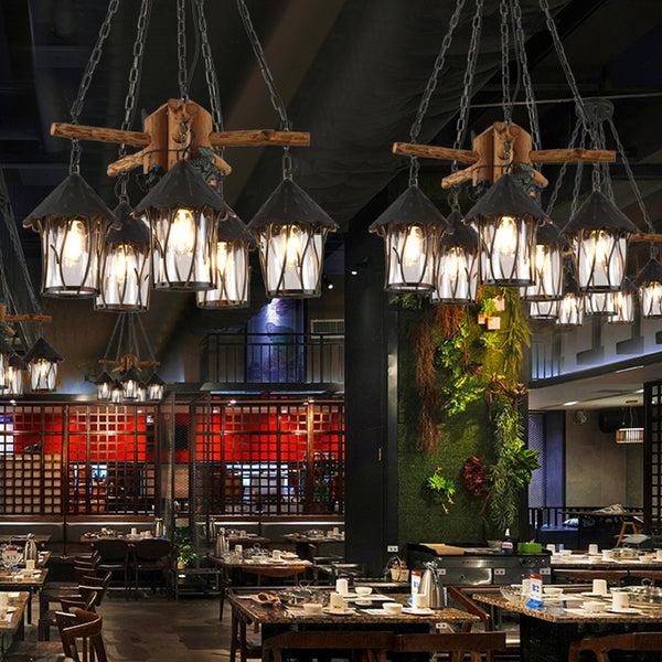 Industrial chandelier installed in a contemporary restaurant with industrial architectural styling.