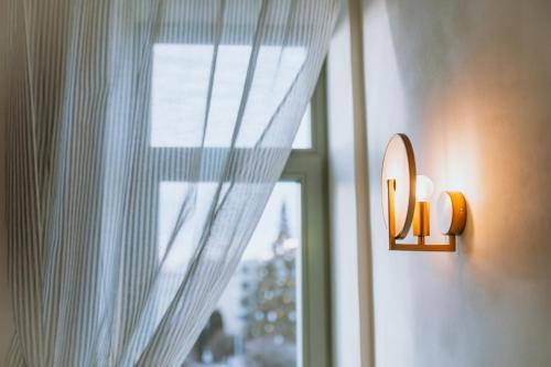 Transitional wall lamp installed in a premium residential interior with timeless architectural styling.