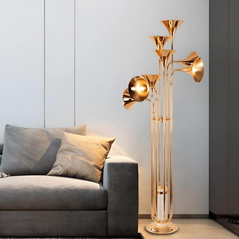 Art Deco floor lamp positioned in a boutique hotel lounge creating a glamorous atmosphere with warm architectural ambient lighting.