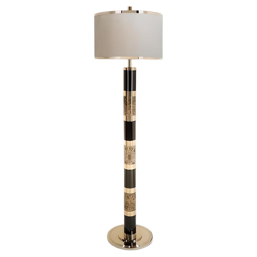 Art Deco floor lamp photographed on a clean white background showcasing geometric forms, luxurious materials and refined finishes.