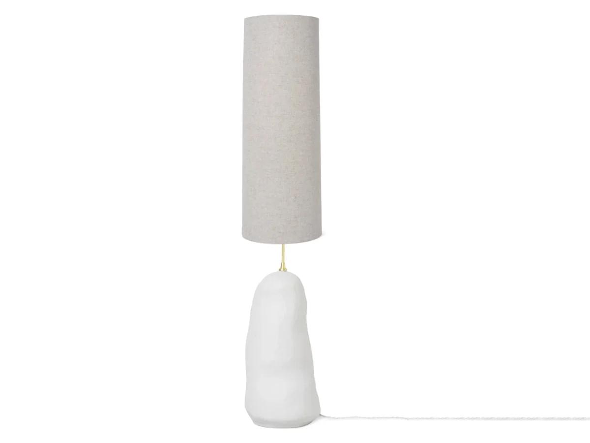 Organic floor lamp photographed on a clean white background showcasing flowing sculptural forms and premium natural materials.