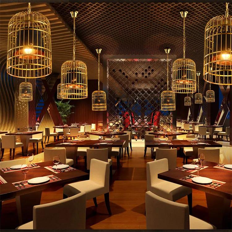Cage chandelier installed in a contemporary hospitality interior with industrial architectural styling.