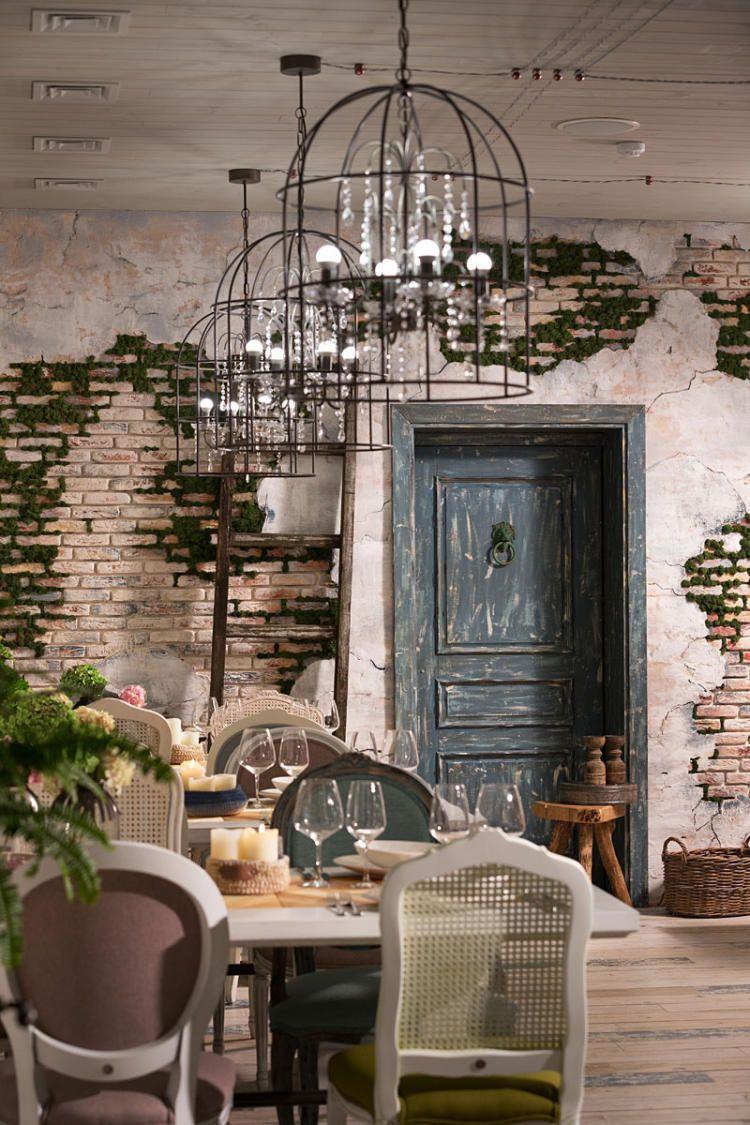 Cage chandelier installed in a contemporary hospitality interior with industrial architectural styling.