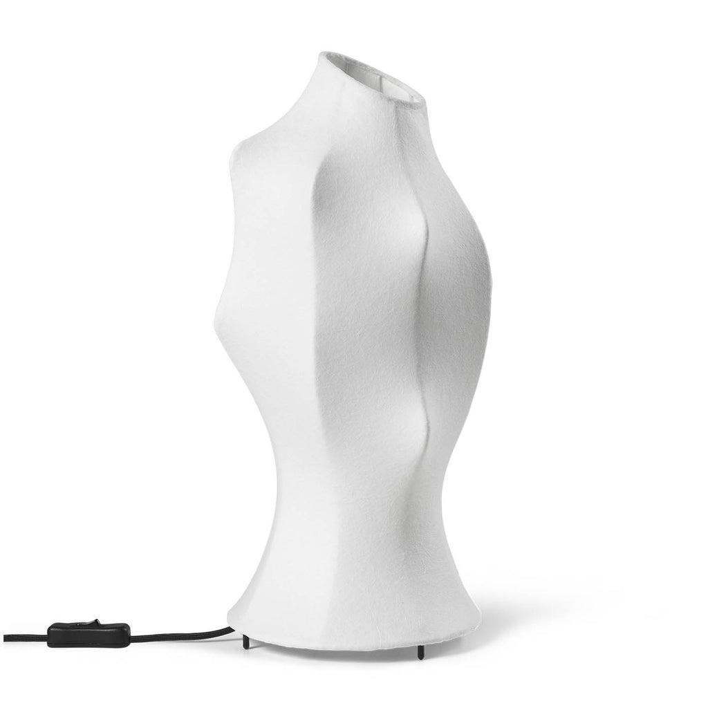 Organic table lamp photographed on a clean white background showcasing soft sculptural curves and natural materials.