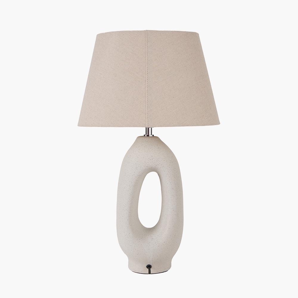 Organic table lamp photographed on a clean white background showcasing soft sculptural curves and natural materials.