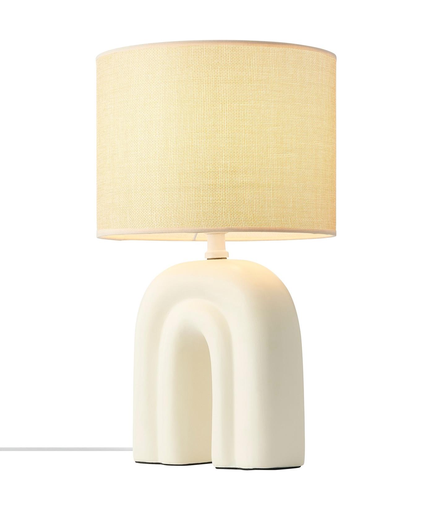 Organic table lamp photographed on a clean white background showcasing soft sculptural curves and natural materials.