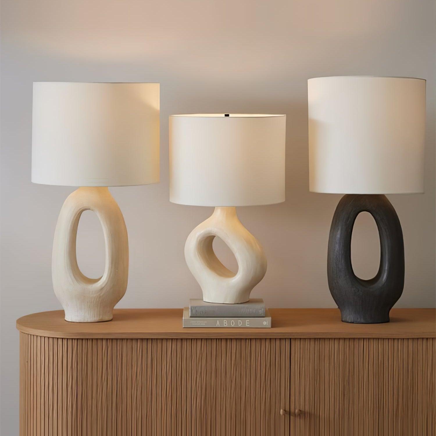 Collection of organic table lamps featuring ceramic, wood and glass elements inspired by nature.