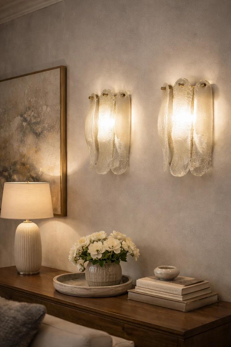 Murano wall lamp installed in a luxury hospitality interior with refined architectural styling.