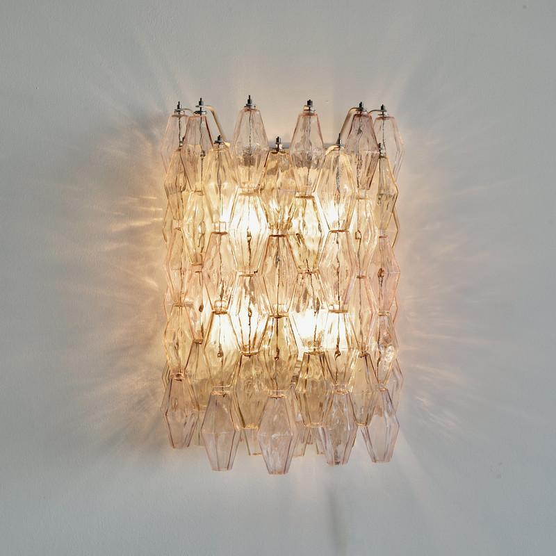 Front view of an elegant Murano wall lamp featuring artistic hand-blown glass.