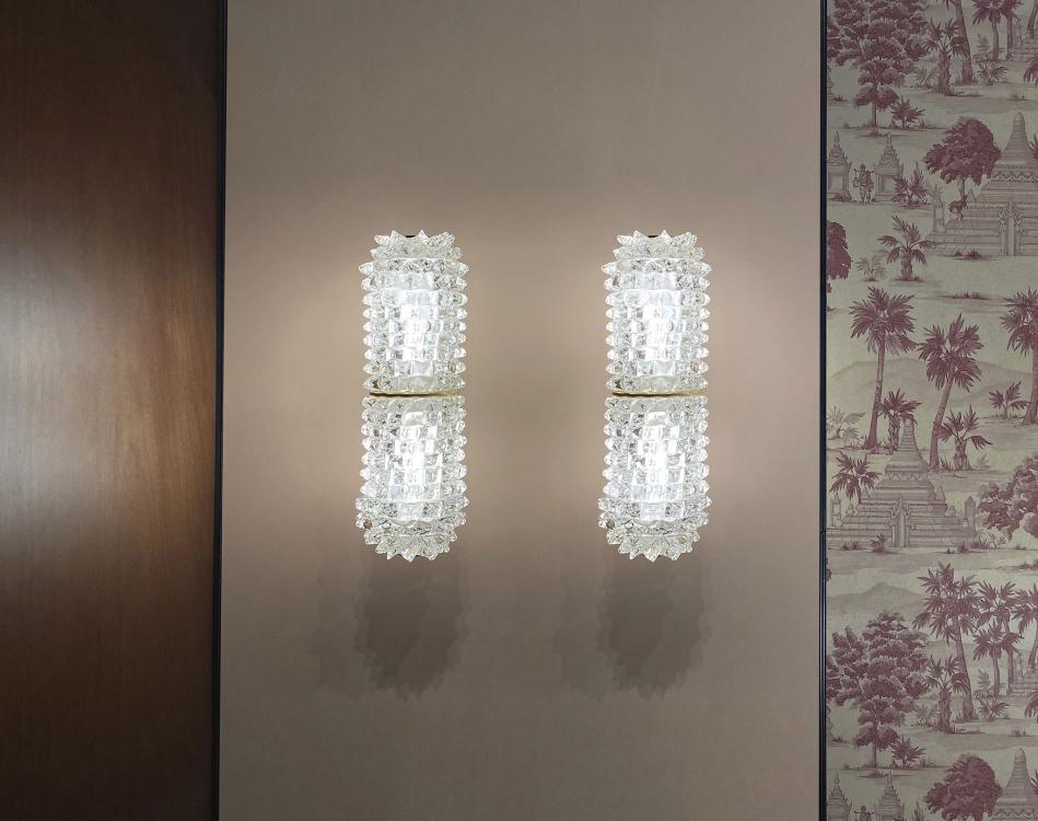 Murano wall lamp installed in a luxury hospitality interior with refined architectural styling.