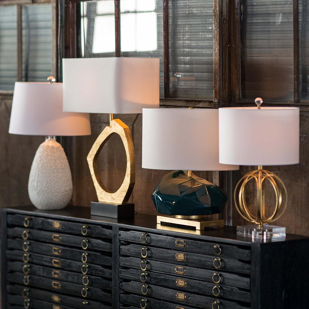 Collection of sculptural table lamps featuring contemporary artistic forms and premium decorative finishes.
