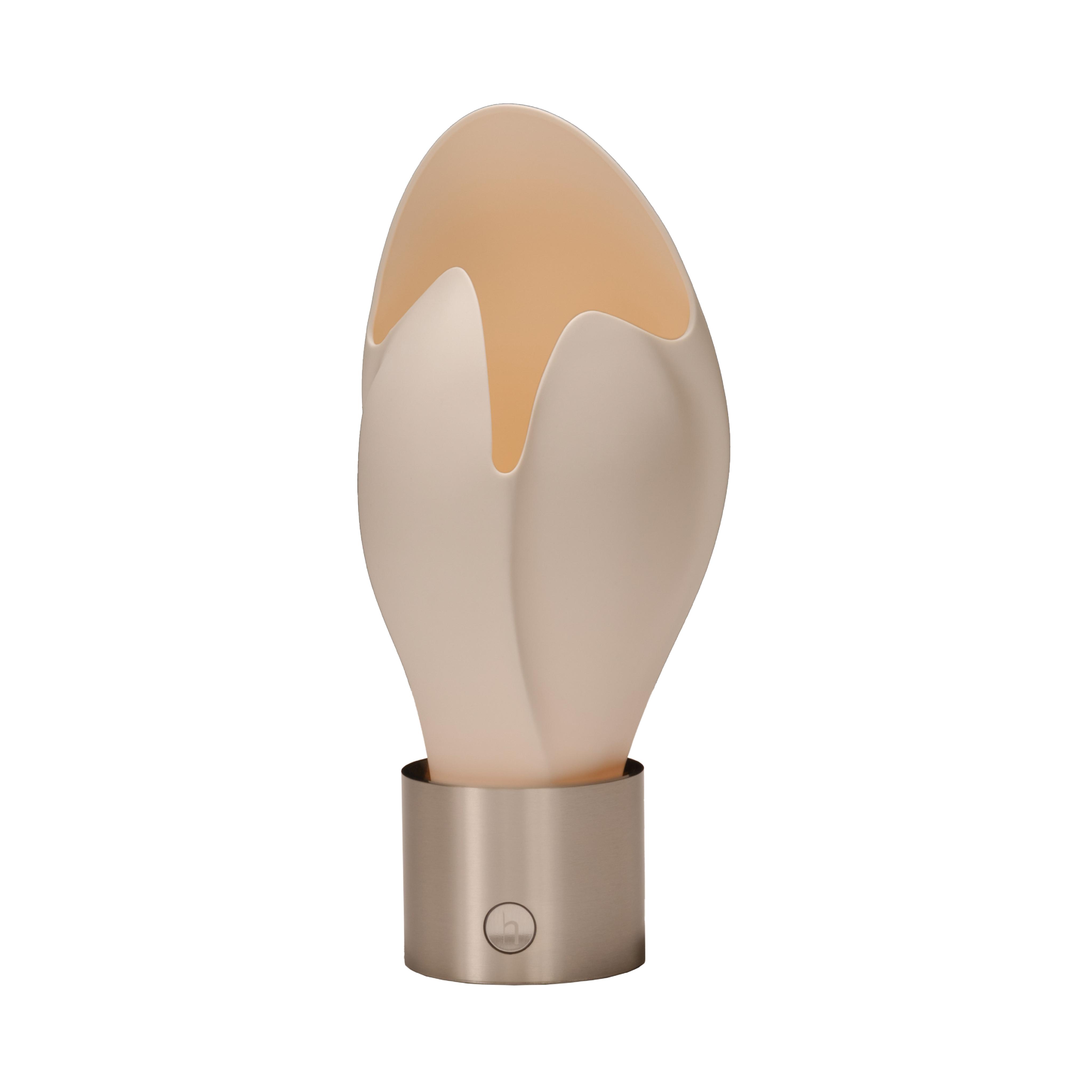 Sculptural table lamp photographed on a clean white background highlighting its artistic form and premium craftsmanship.