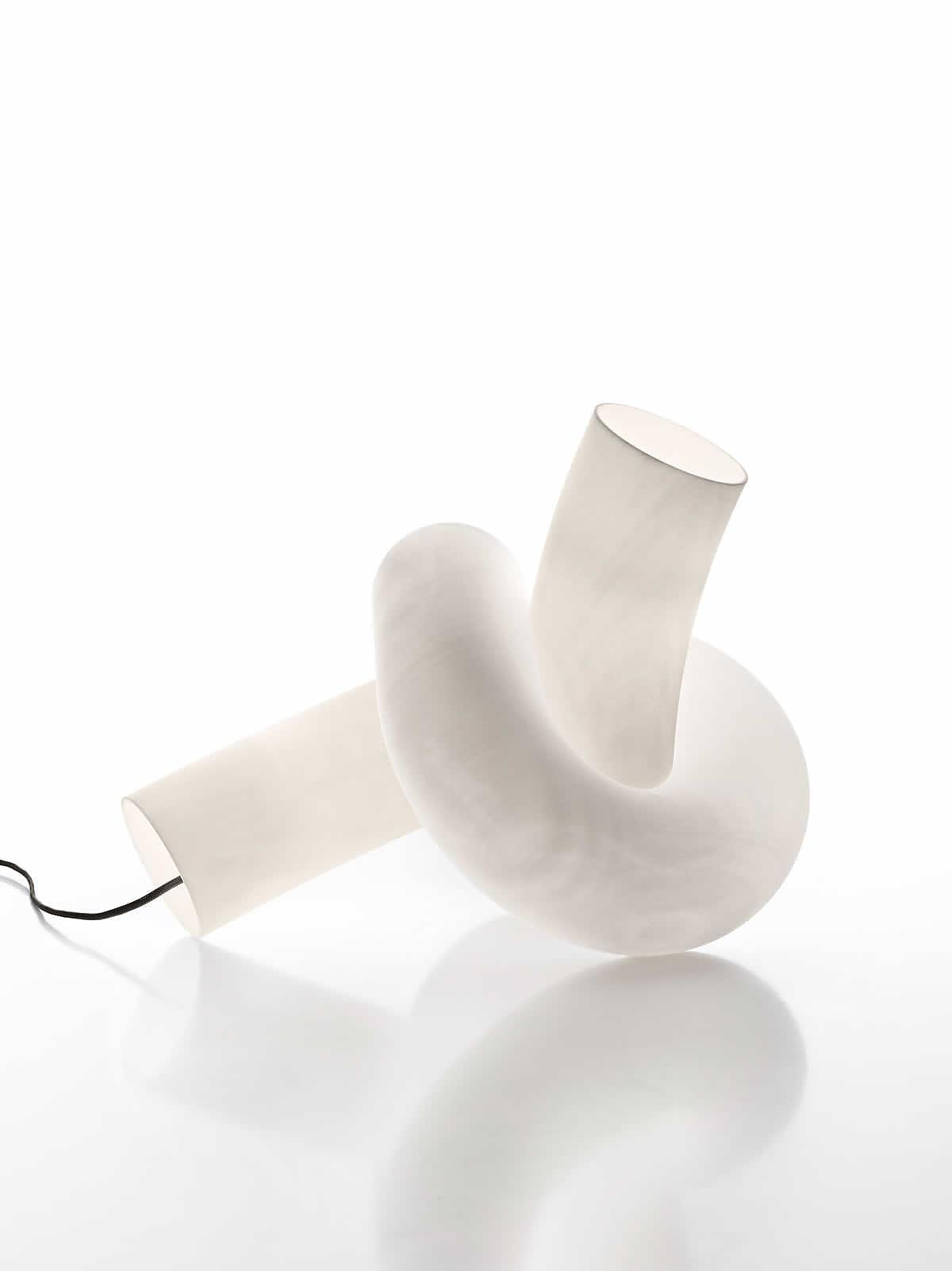 Sculptural table lamp photographed on a clean white background highlighting its artistic form and premium craftsmanship.
