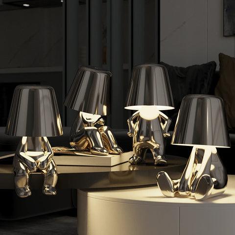 Collection of sculptural table lamps featuring contemporary artistic forms and premium decorative finishes.