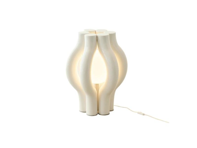 Sculptural table lamp photographed on a clean white background highlighting its artistic form and premium craftsmanship.