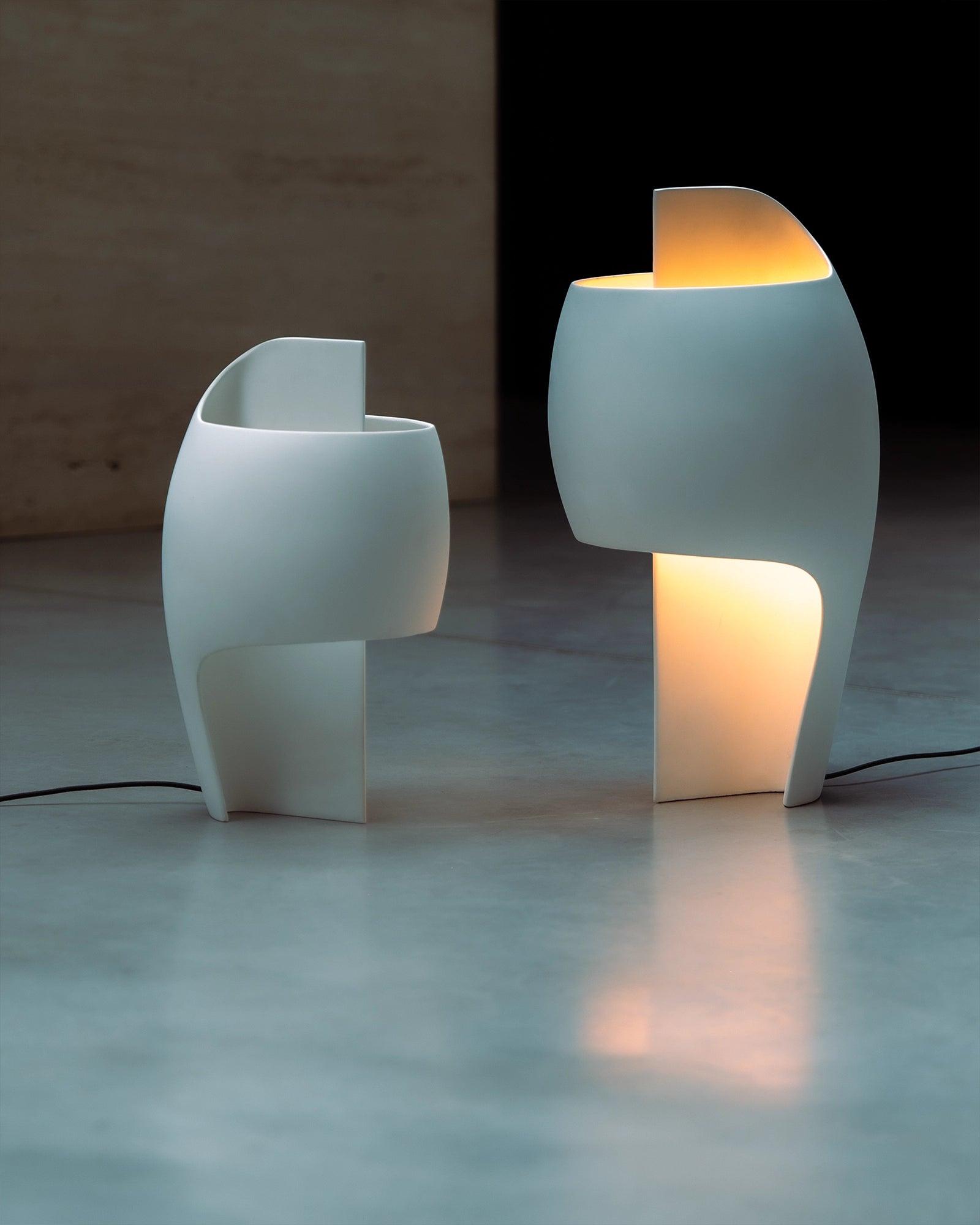 Collection of sculptural table lamps featuring contemporary artistic forms and premium decorative finishes.