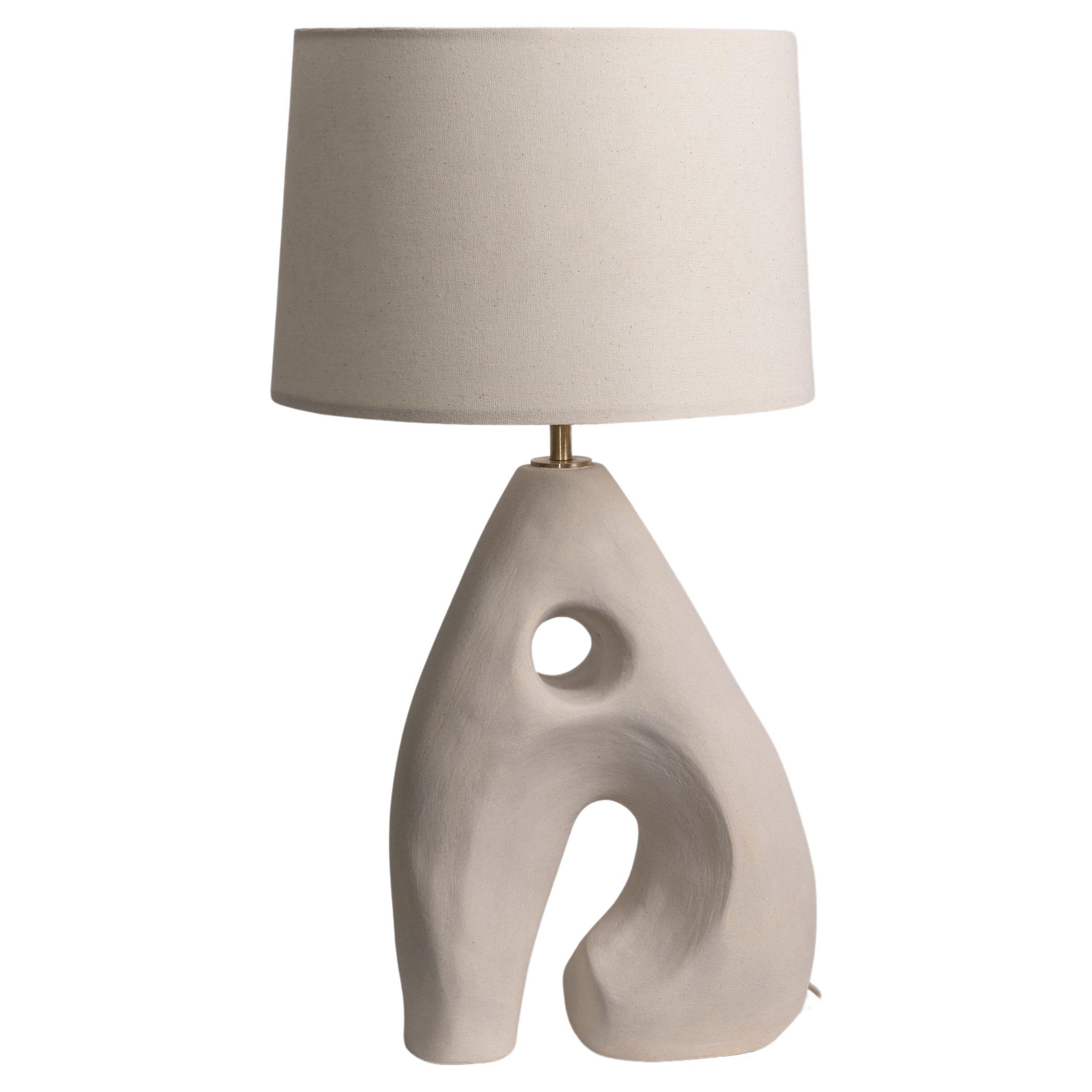 Sculptural table lamp photographed on a clean white background highlighting its artistic form and premium craftsmanship.