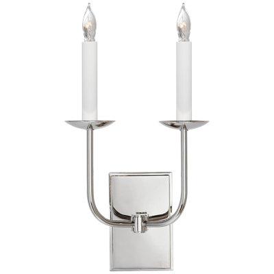 Candle-style wall lamp photographed on a clean white studio background.